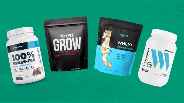 A line-up of different protein powders including, in order, Transparent Labs 100% Grass-Fed Whey Protein Isolate, XWERKS GROW 100% New Zealand Grass-Fed Whey Protein Isolate, Legion Whey+ Whey Protein Powder, and Swolverine Plant Protein Powder against a green background